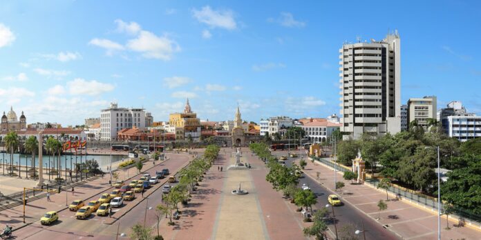 A panoramic view of the historic Old City of Cartagena, Colombia, showing colonial architecture and colorful rooftops.